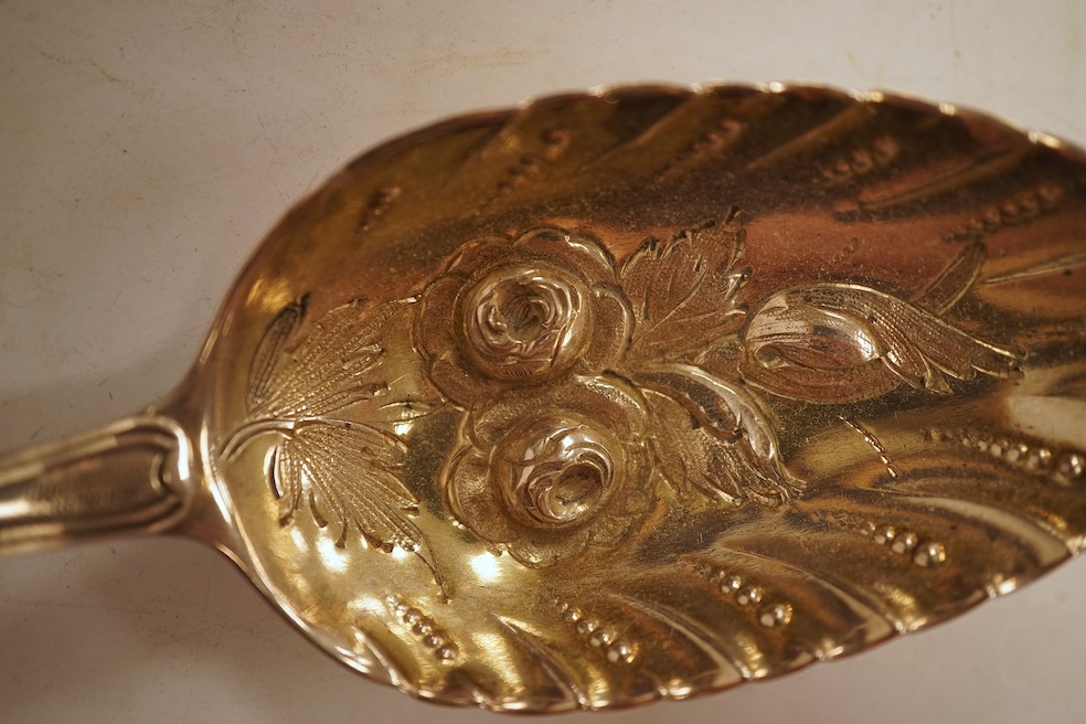A pair of George III silver Old English pattern berry spoons, by Eley, Fearn & Chawner, London, 1810, 22.1cm, together with three Victorian silver fiddle pattern teaspoons, 6.8oz, together with a pair of plated sugar ton